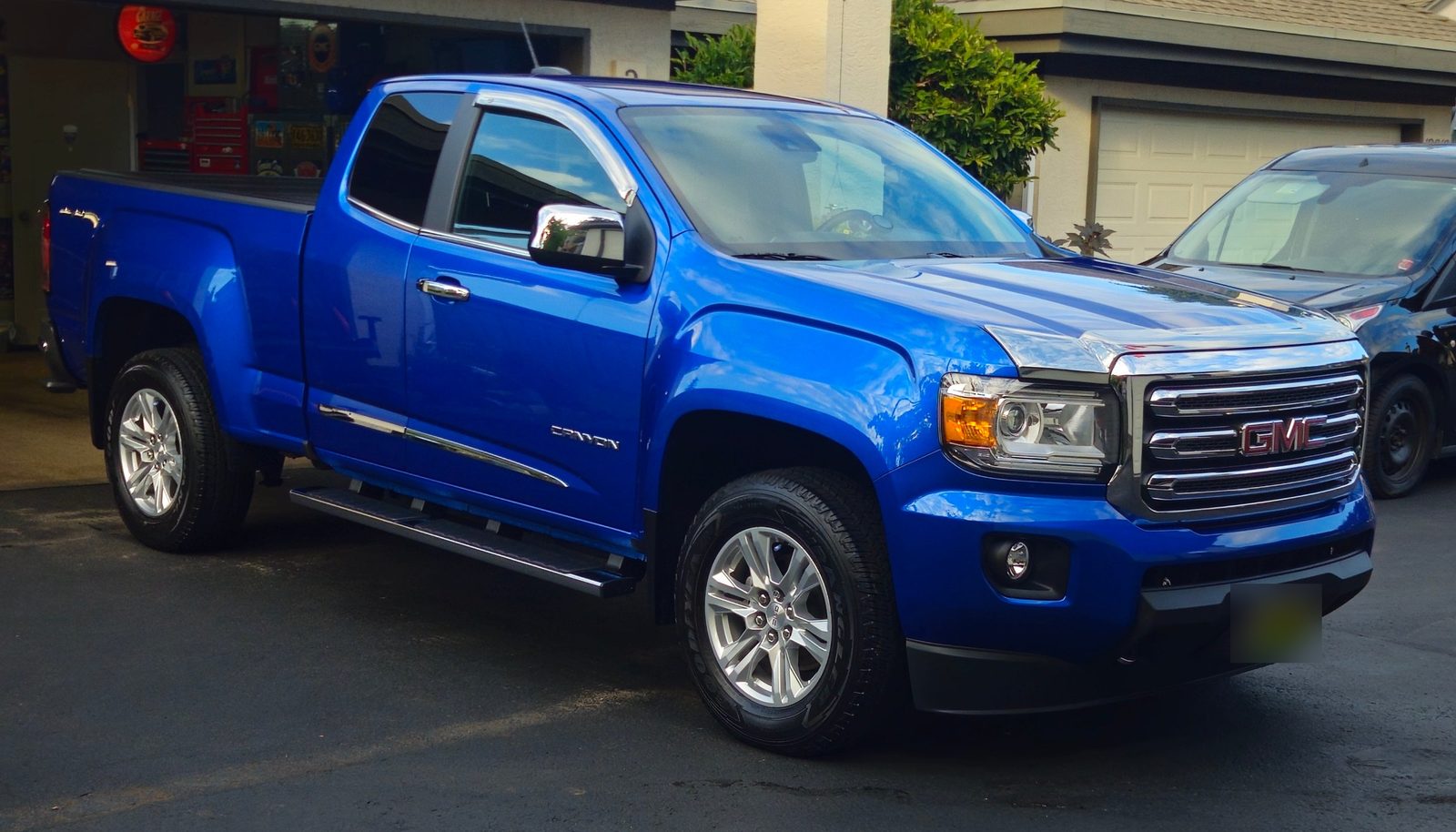 Blue GMC Canyon pickup, clean and glossy after detailing by Vantique Detailing