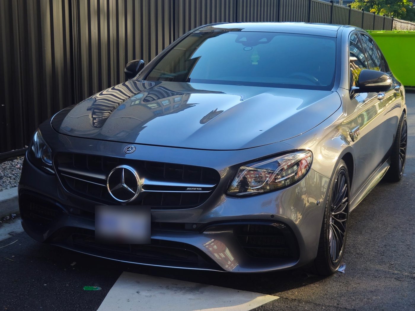Grey Mercedes-AMG sedan with a glossy finish after a ceramic coating by Vantique Detailing