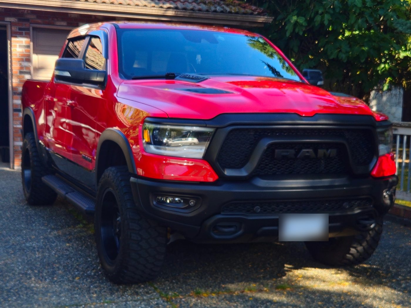 Red Ram 1500 pickup with a deep gloss after a ceramic coating by Vantique Detailing