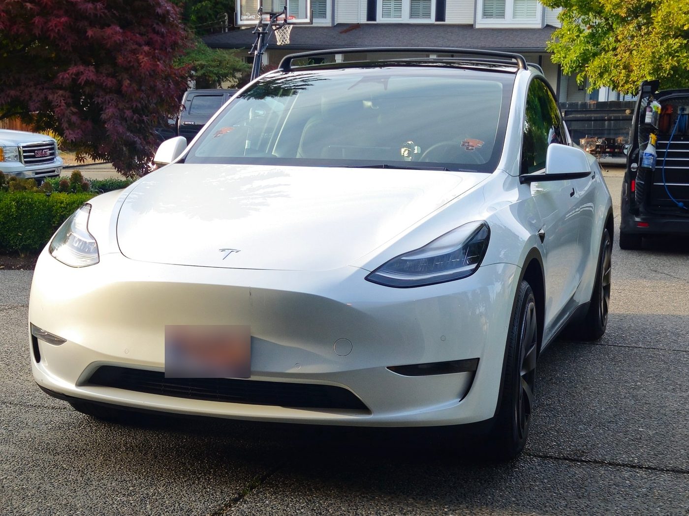 White Tesla Model Y after a ceramic coating by Vantique Detailing
